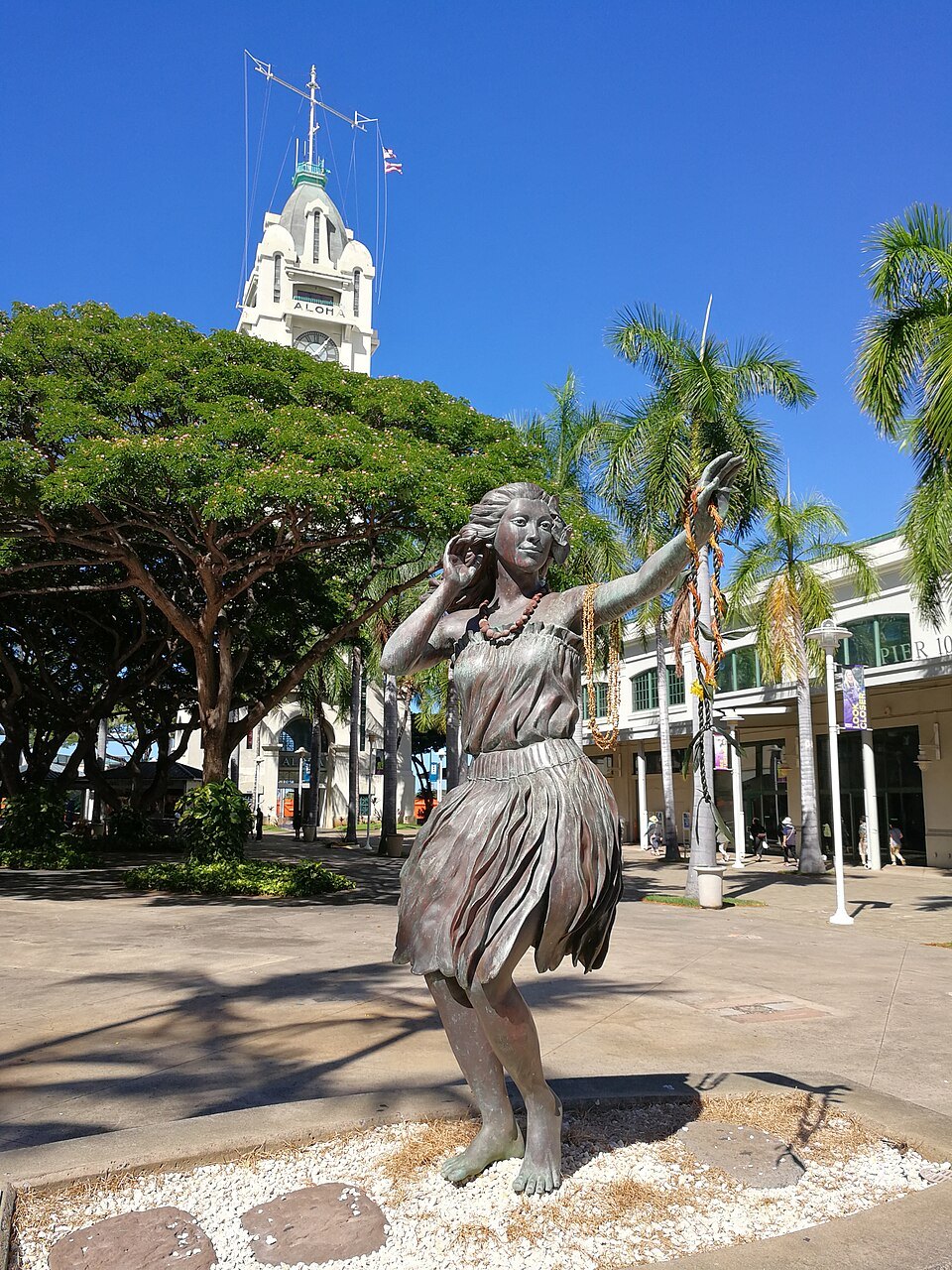 A bronze of a dancer in the plaza below Aloha Tower
