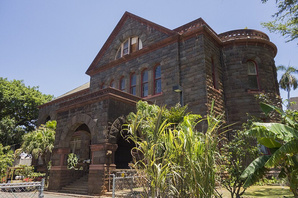Hawaiian Hall, the museum's oldest building, in dark basalt