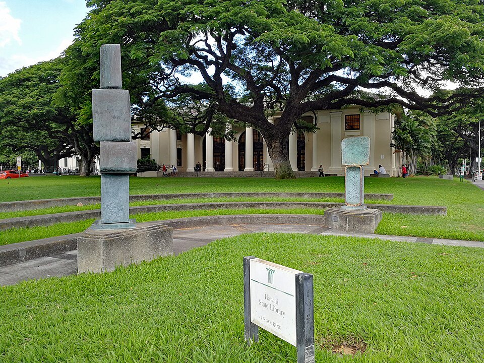 Sculpture on the lawn of the Capitol District, the State Library behind