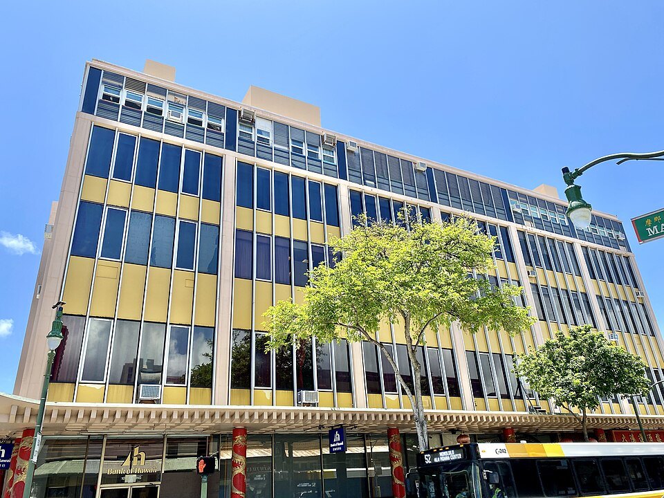 C. Q. Yee Hop Plaza on King Street, its windows banded in yellow