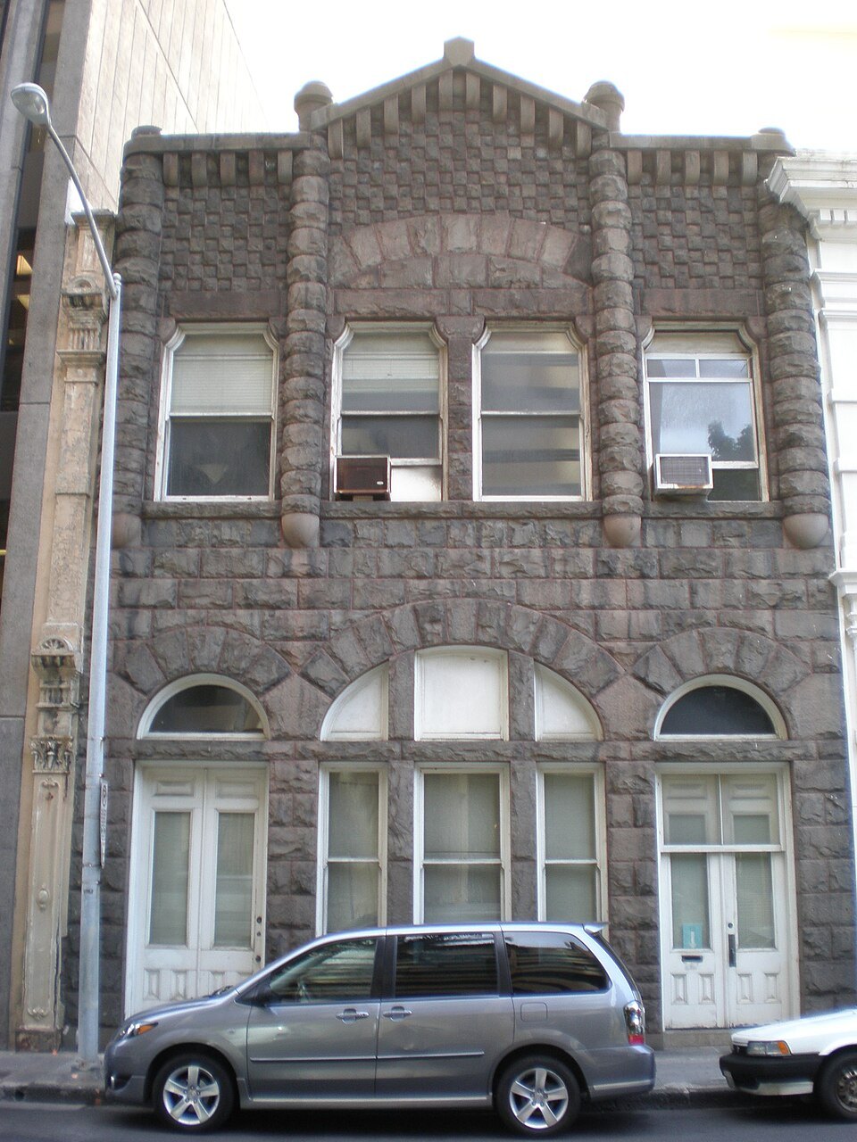 The Bishop Estate Building on Merchant Street, faced in dark volcanic stone