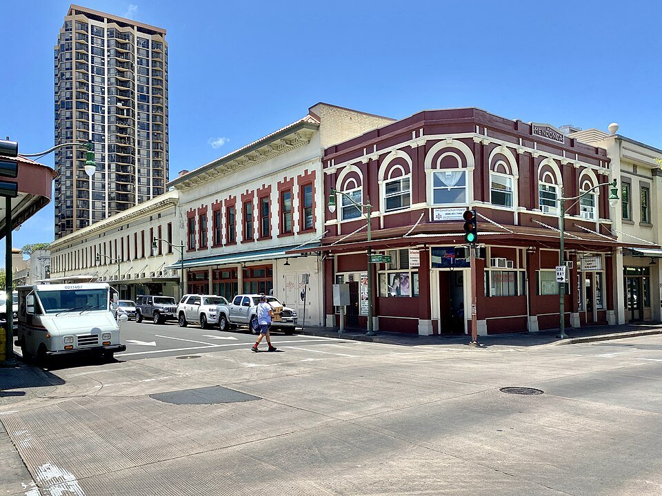 The red-brick corner of the Mendonca Building at Hotel and Smith