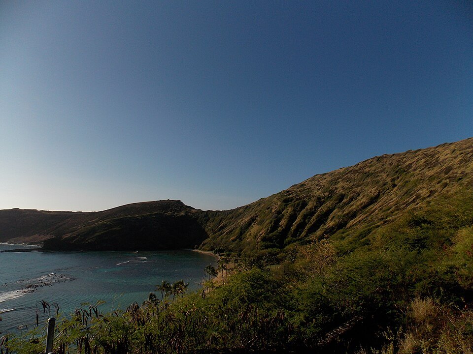 Hanauma Bay's curve of sand below the crater ridge
