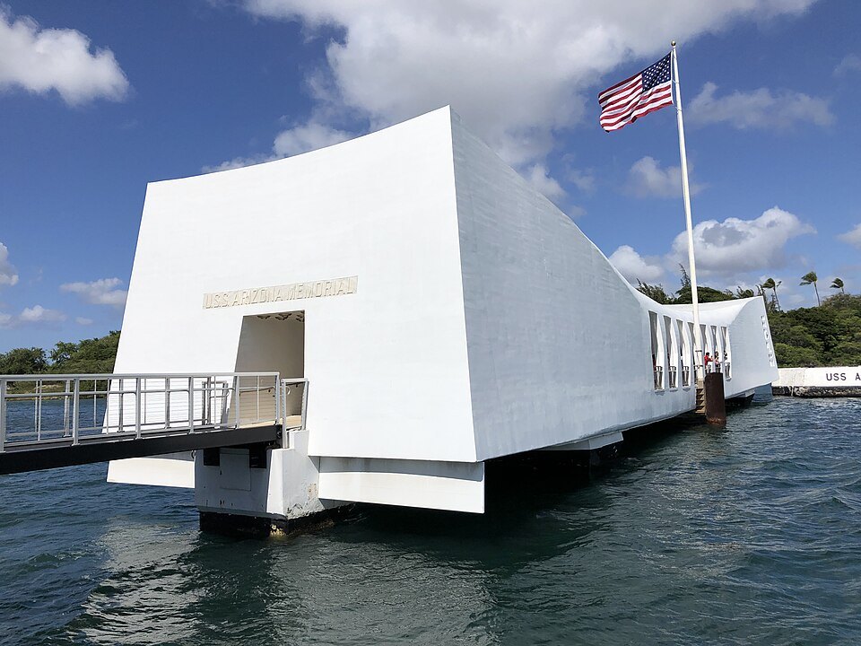 The USS Arizona Memorial and its flag, from the water