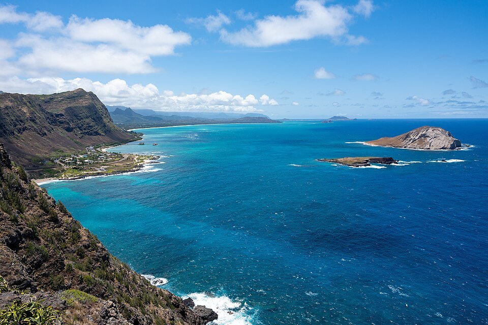 The Makapuʻu coast and its offshore islets, the water shading to deep blue