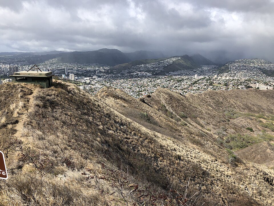 The Koʻolau and the city under rain clouds, from the Diamond Head summit