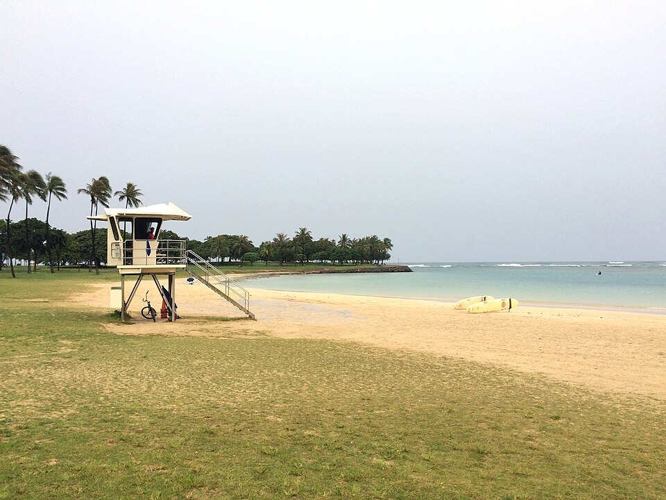 An empty beach and a lifeguard tower as a storm passed far offshore