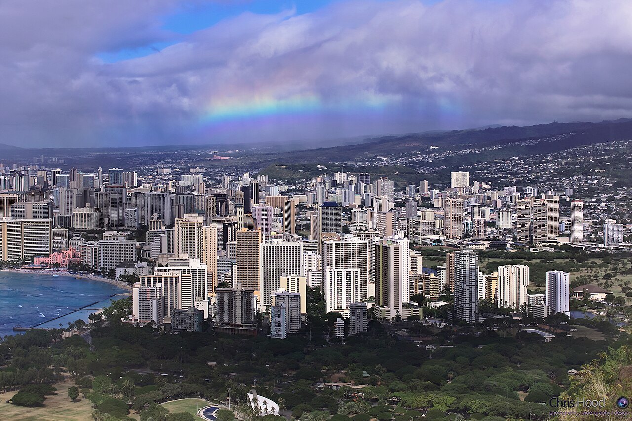 A rainbow over Waikīkī and the valleys behind it