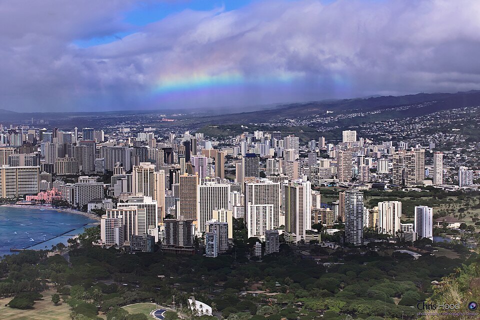A rainbow over Waikīkī and the valleys behind it