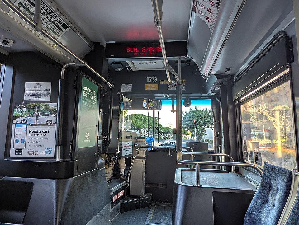 Inside a TheBus coach, looking forward past the fare box
