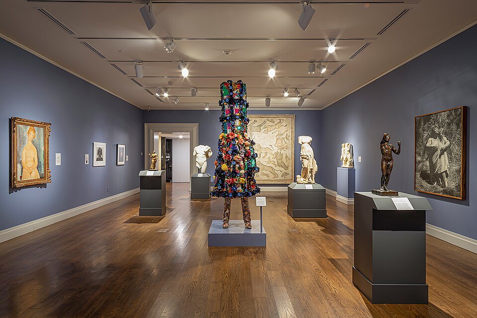 A gallery at the museum, sculpture and paintings under soft light