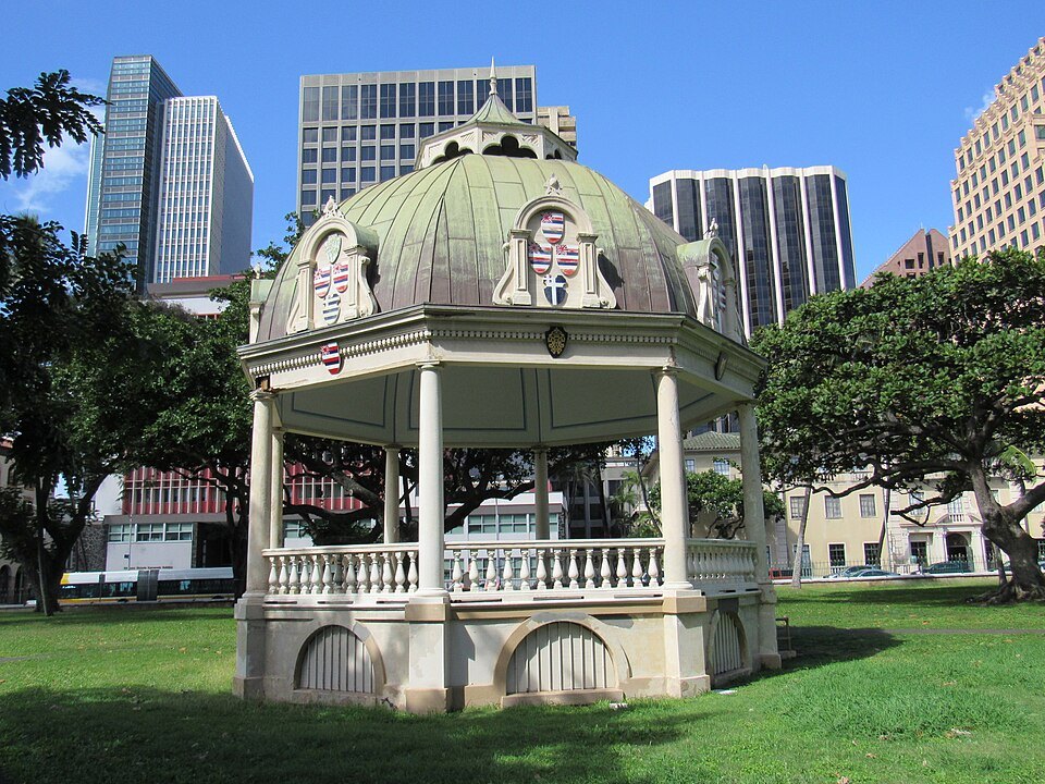 The coronation pavilion on the palace grounds, the downtown towers behind