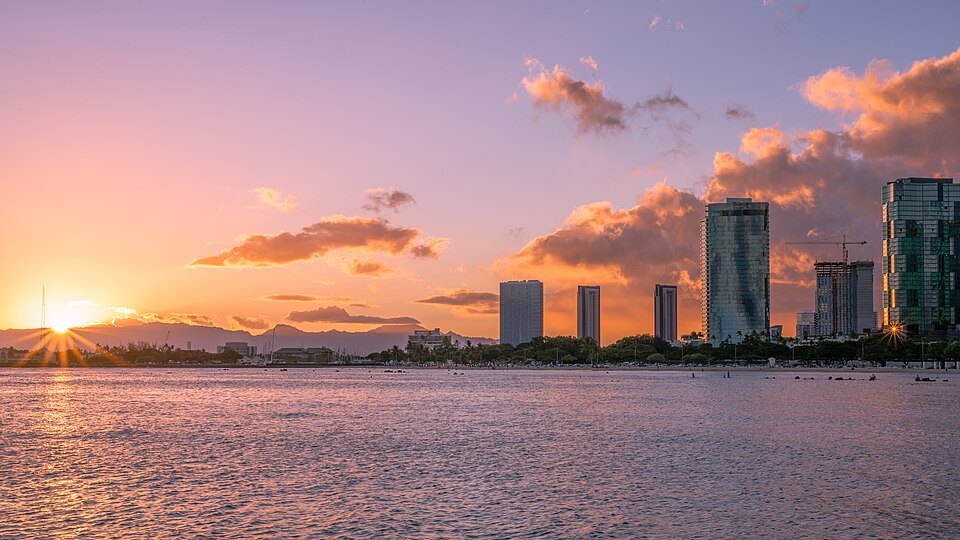 Sunset over the water with the new towers of Kakaʻako