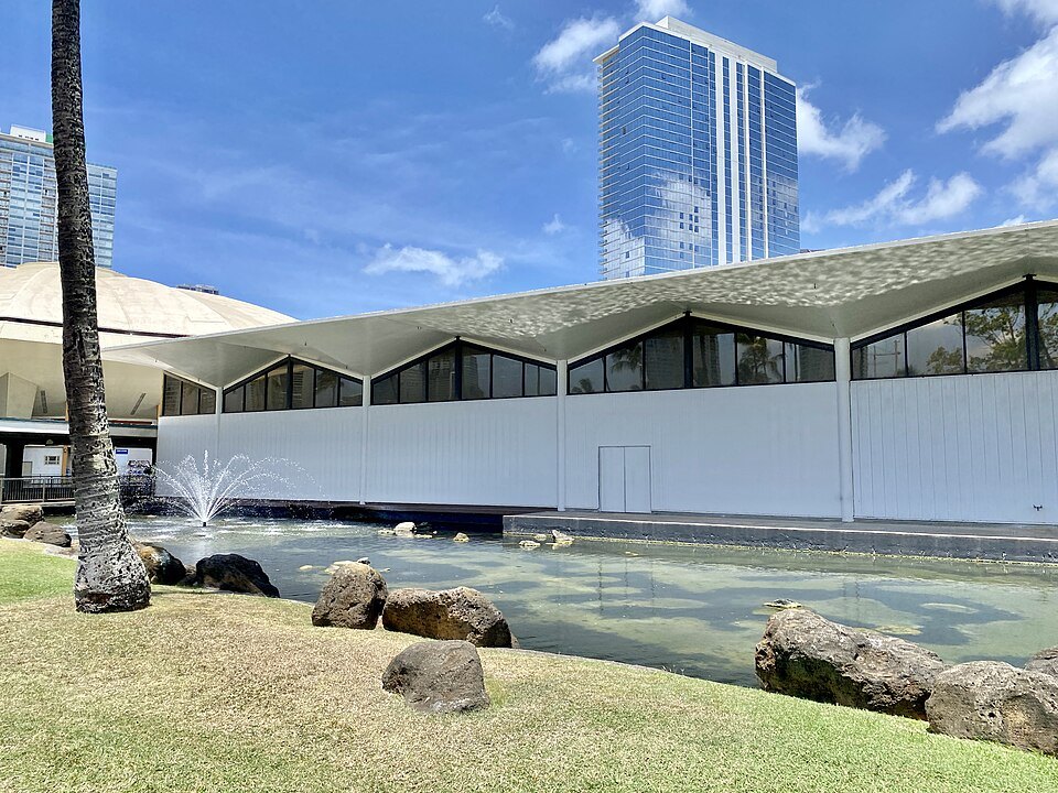 The Blaisdell Center's exhibition hall and its pond, towers behind