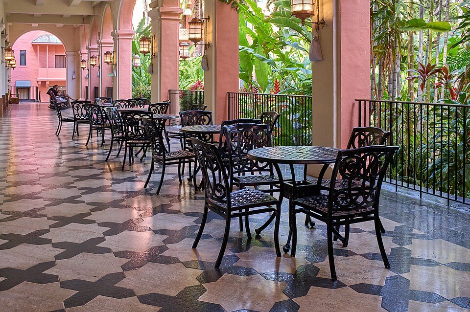 The Royal Hawaiian's arcaded lanai, set with tables