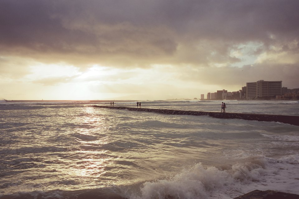 Evening light over the water off Waikīkī, the hotels along the shore